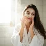Girl applying a natural face mask